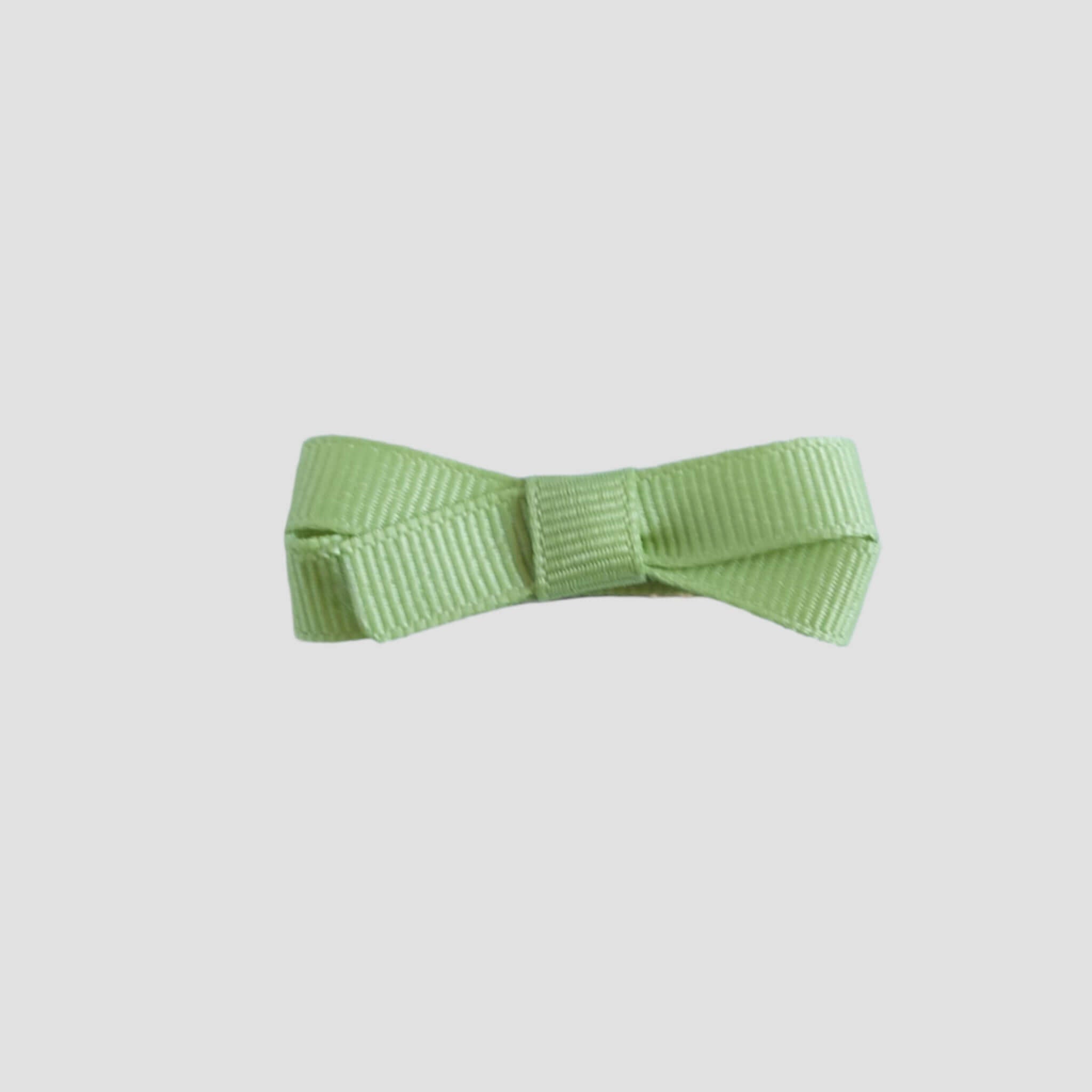 Lemon grass green bow on a white background