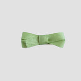 Lemon grass green bow on a white background