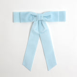 Light blue Grace velvet hair bow for women. Double bow with long tails on white background 