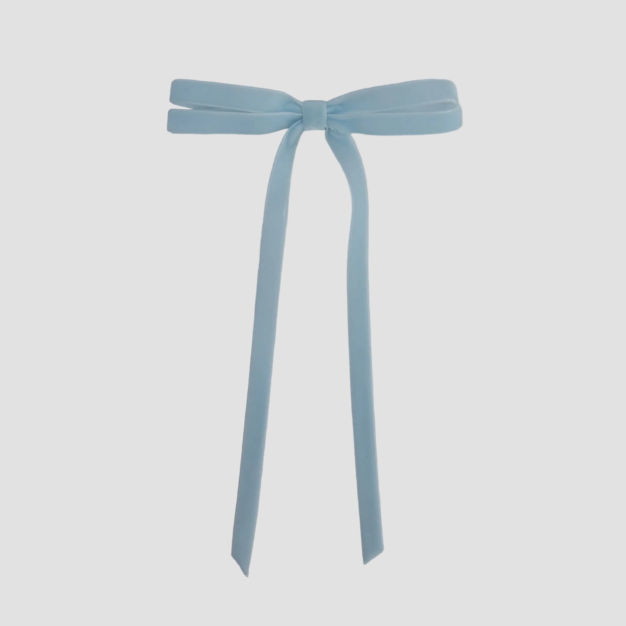 Light blue Olivia velvet hair bow for women with long tails on white background