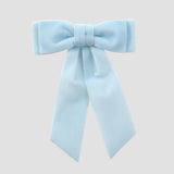 Light blue velvet Mia bow on a white background