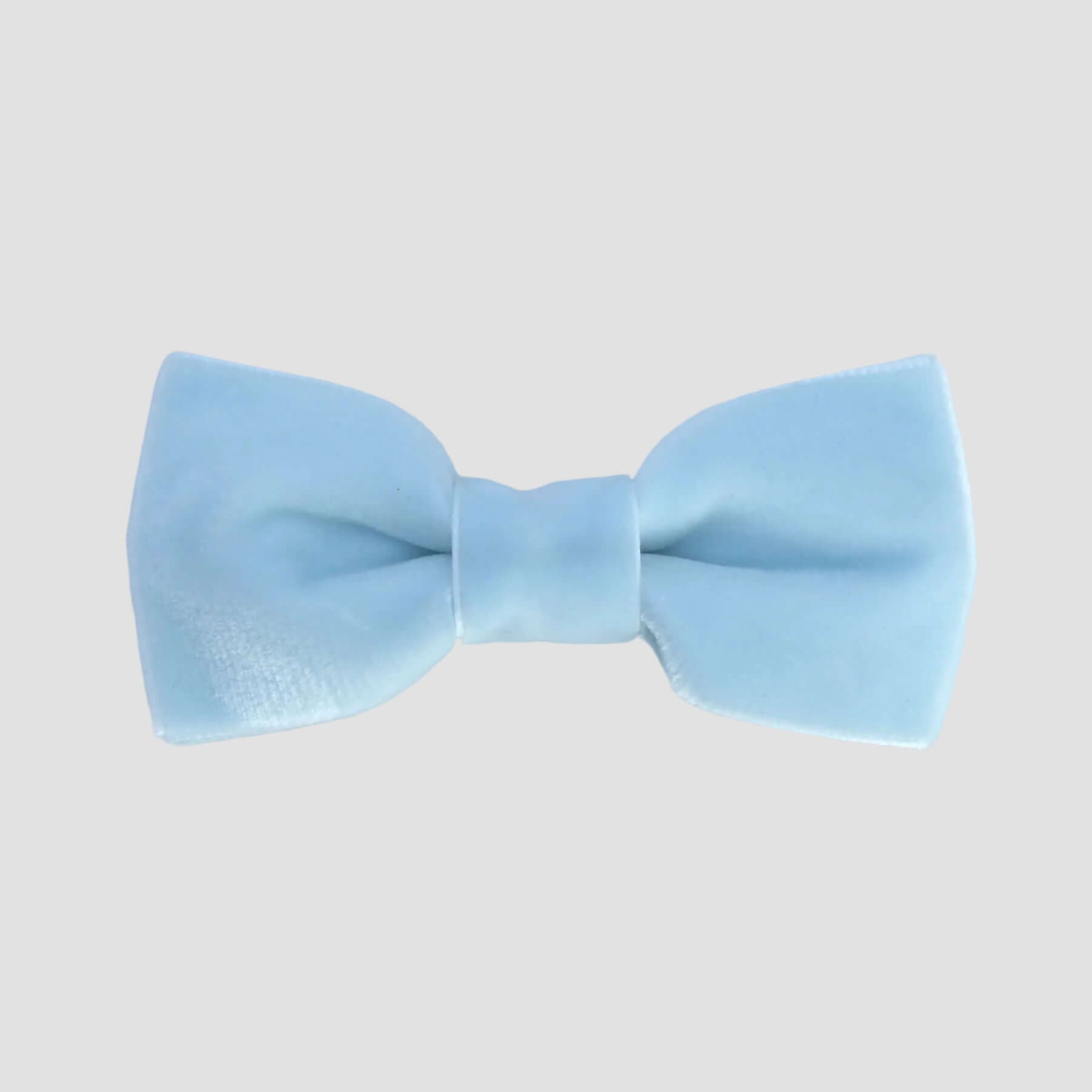 Light blue velvet bow tie on a white background