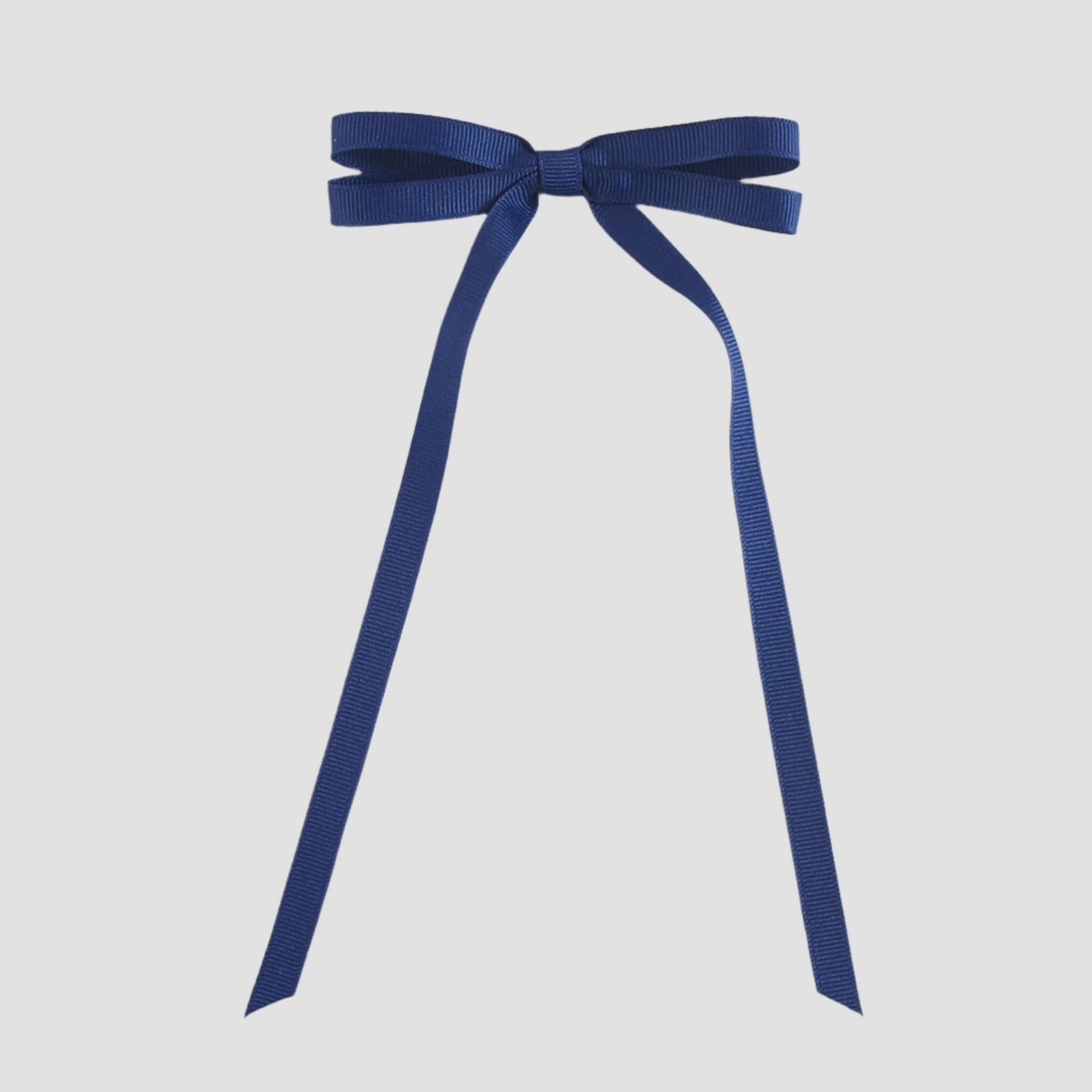 Light navy blue ribbon bow on a white background