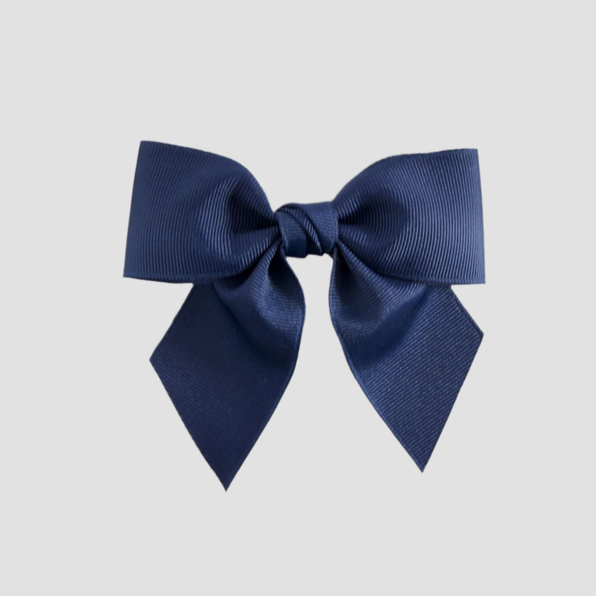 Light navy blue bow on a white background