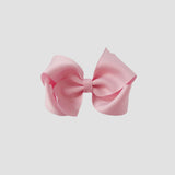 Light pink bow on a white background
