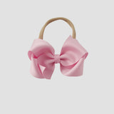 Light pink bow on a nude nylon headband