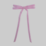 Light pink Olivia velvet hair bow for women with long tails on white background