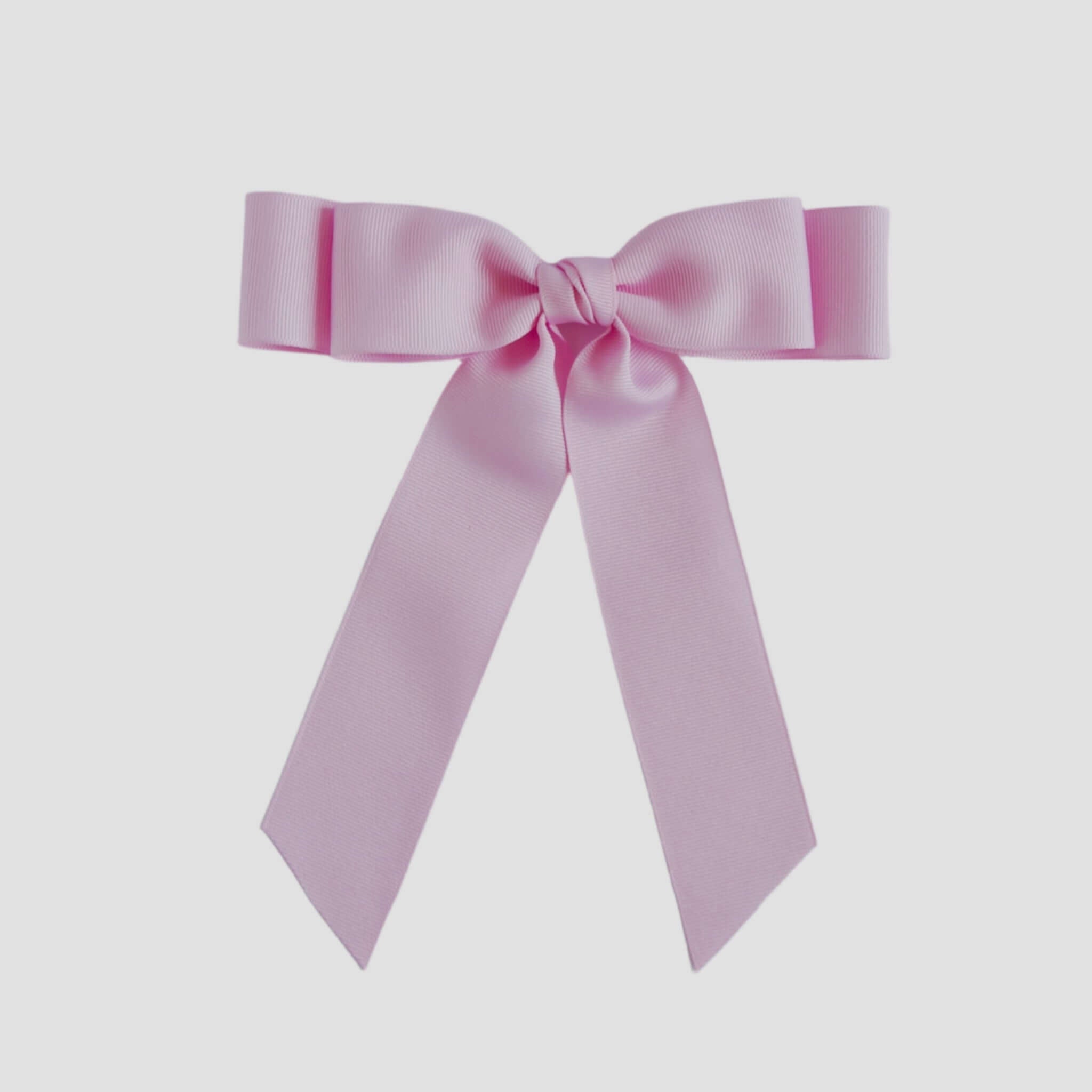 Light pink bow on a white background