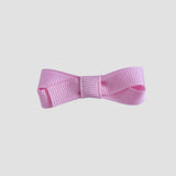Light pink bow on a white background