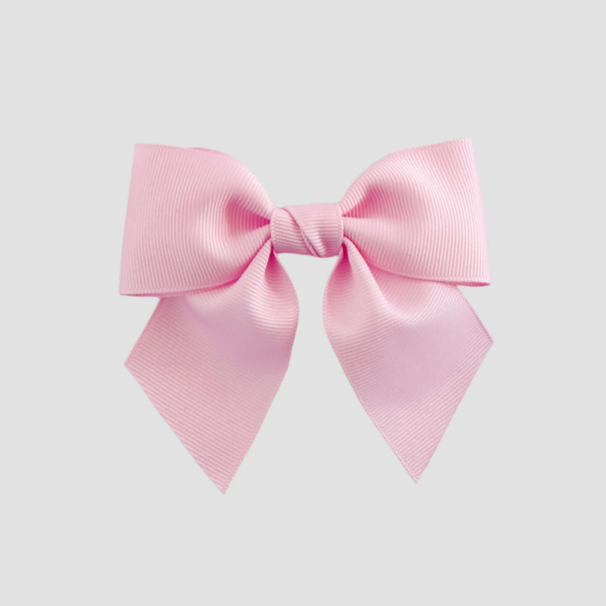 Light pink bow on a white background