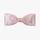 Ava satin bow in light pink on a white background