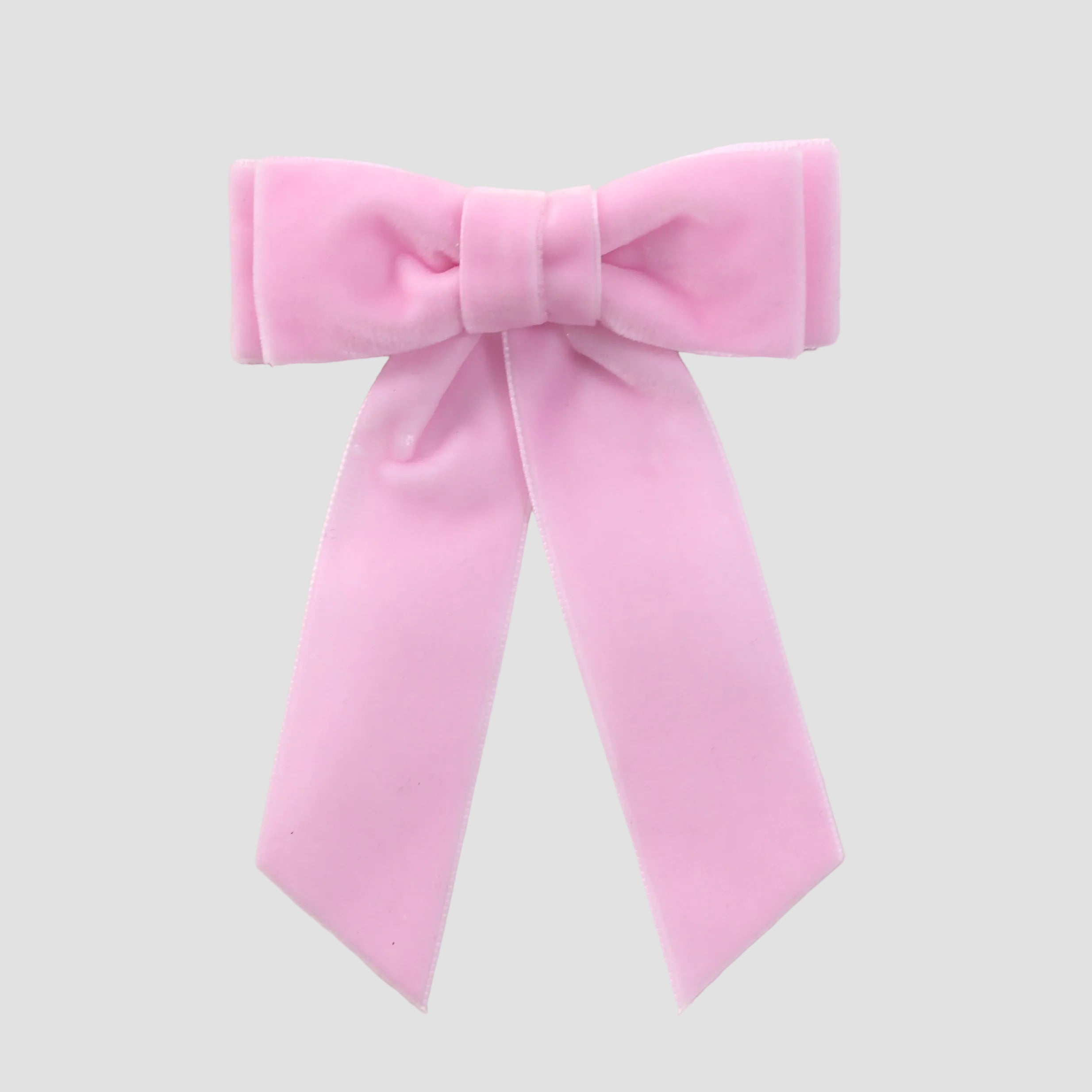 Light pink velvet Mia bow on a white background