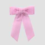 Light pink velvet Mia bow on a white background
