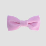 Light pink velvet bow tie on a white background