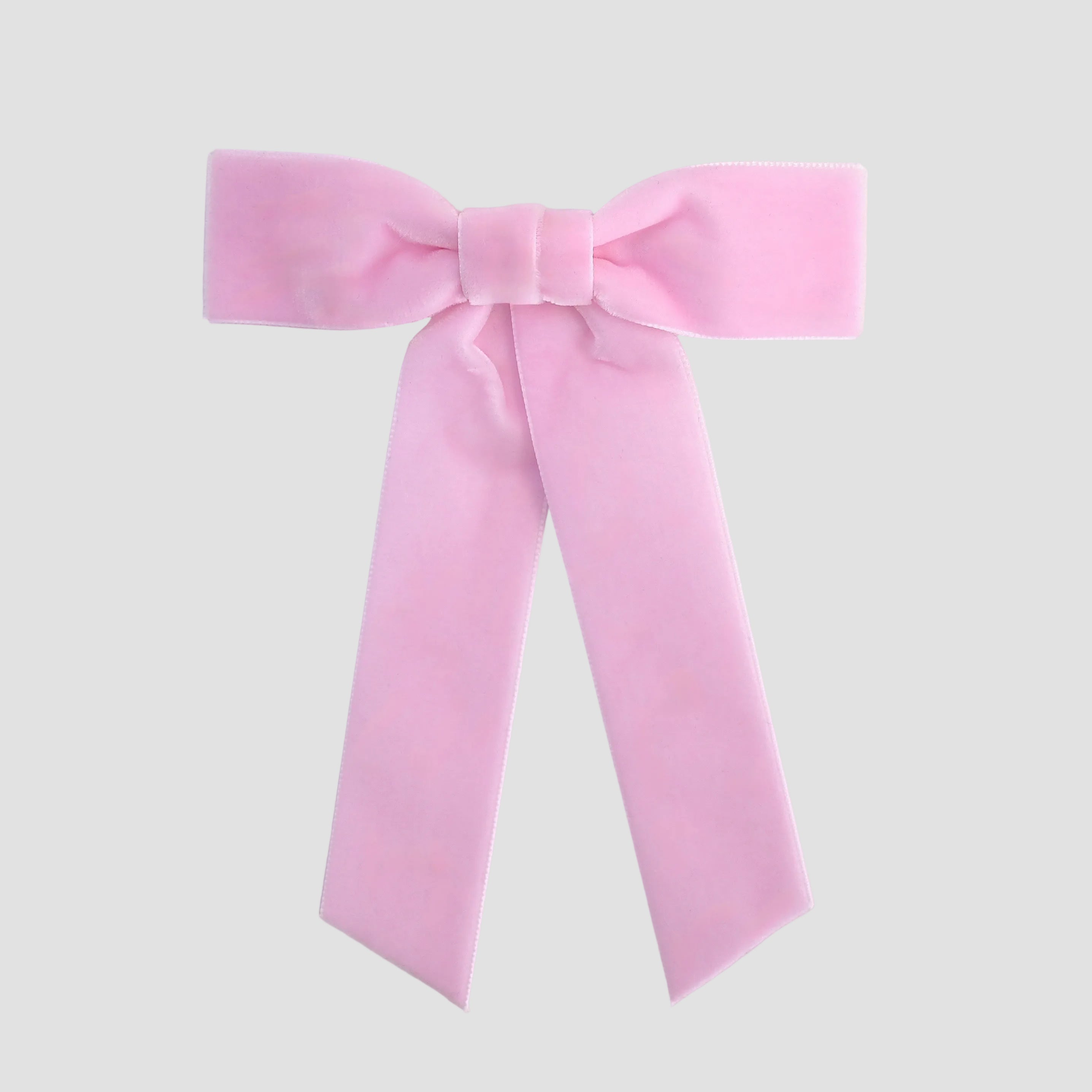 Light pink Zoe petite velvet hair bow on a white background.