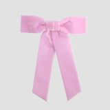 Light pink Zoe petite velvet hair bow on a white background.