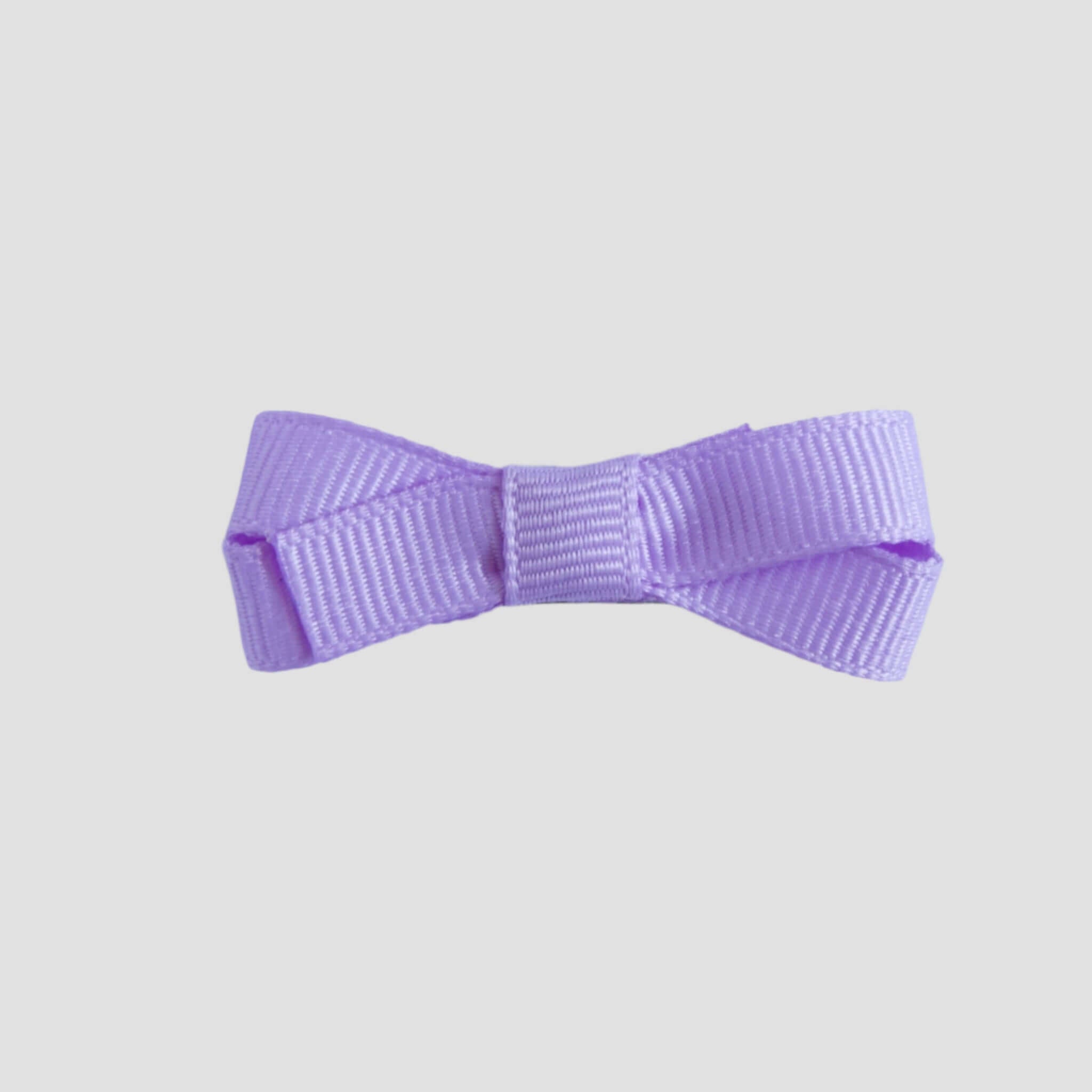 Light orchid purple bow on a white background