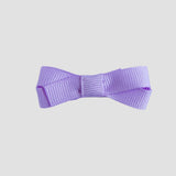 Light orchid purple bow on a white background