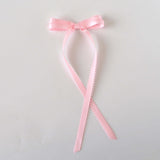 Olivia Picot Satin Bow in soft pink with picot edges, perfect for elegant hairstyles for women and girls.