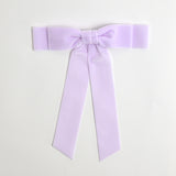 Lilac Grace velvet hair bow for women. Double bow with long tails on white background 