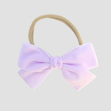 lilac Kayla velvet hair bow headband for baby girl.