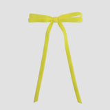 Light yellow Olivia velvet hair bow for women with long tails on white background