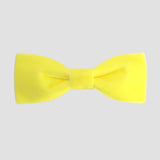 Light yellow men bow tie on a white background.