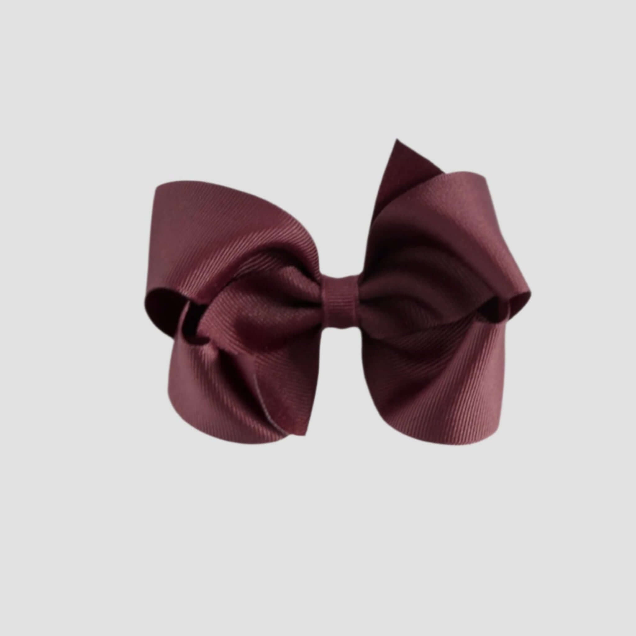 Maroon hair bow on a white background