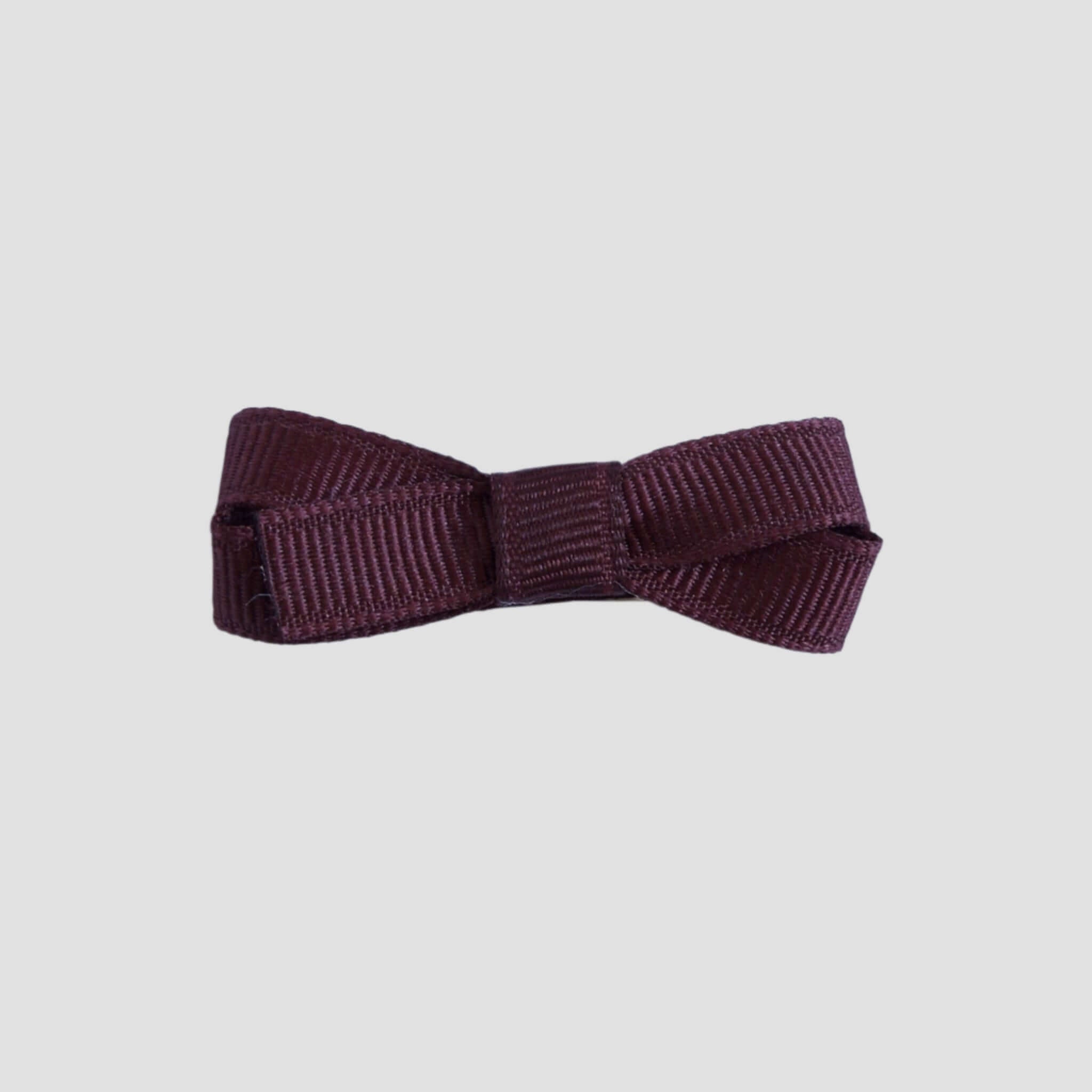 Maroon bow on a white background
