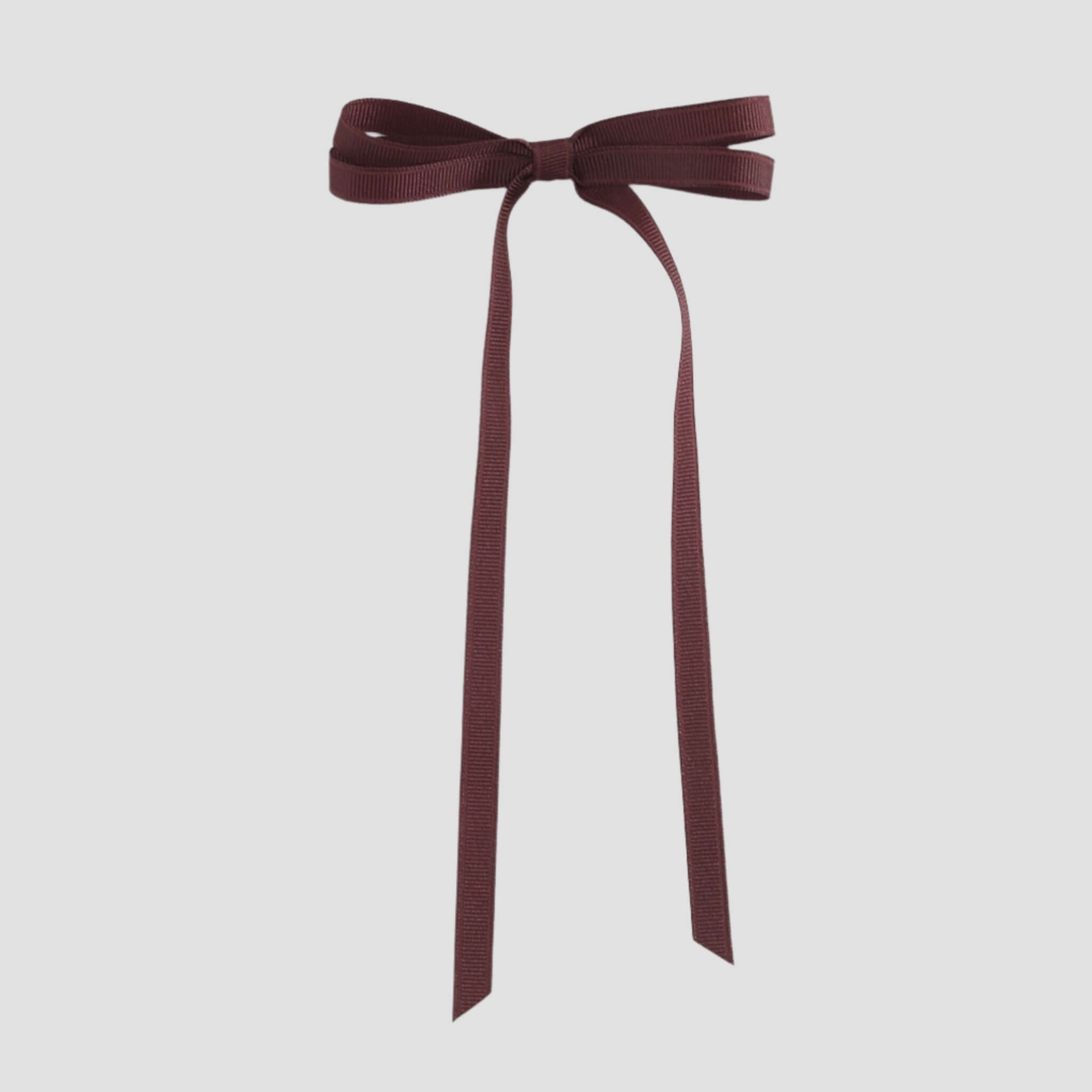 Maroon ribbon bow on a white background