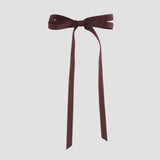 Maroon ribbon bow on a white background