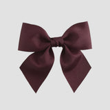 Maroon bow on a white background
