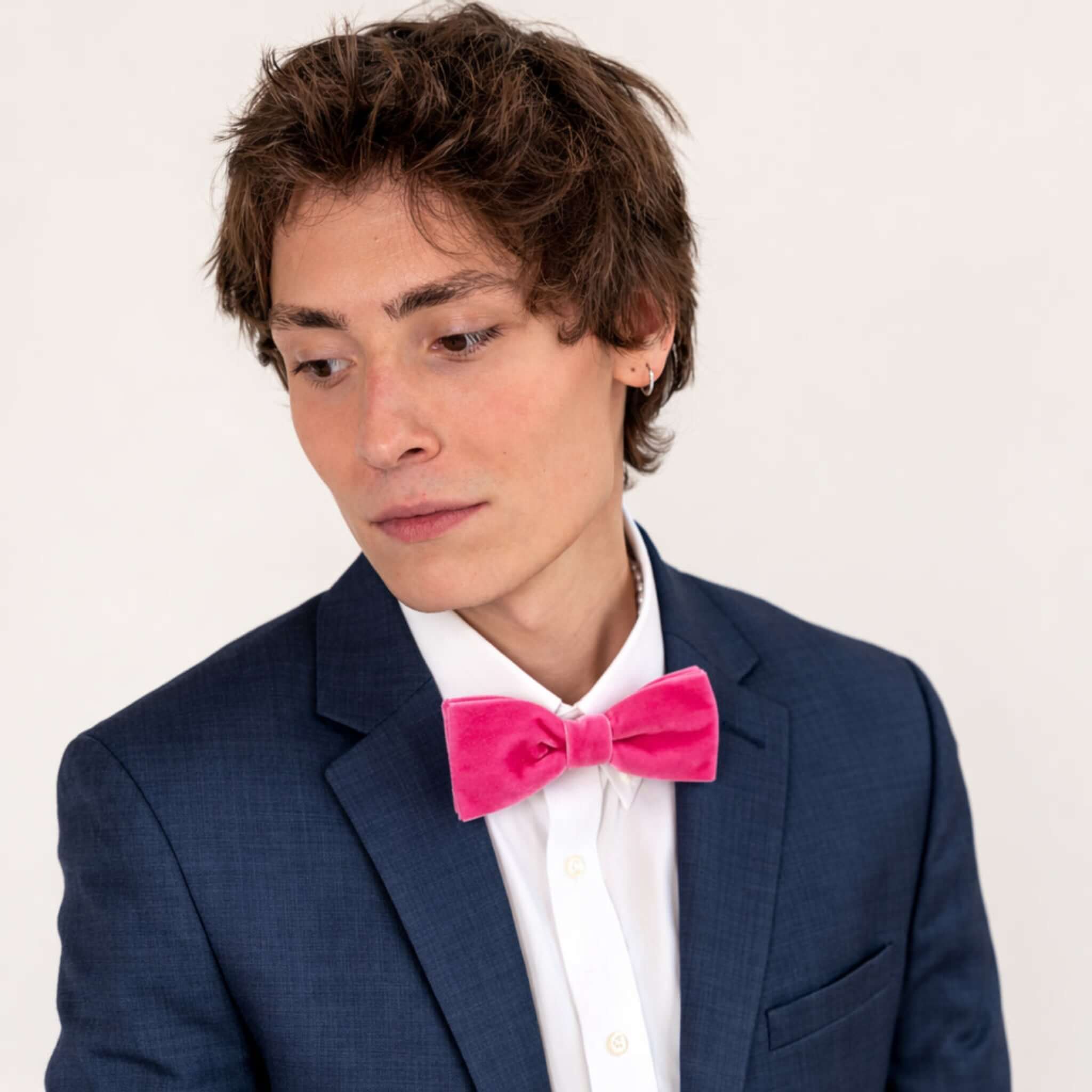 young men wearing velvet bow tie in hot pink