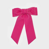 Bright pink party ready hair accessories.