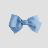 Light blue bow on a lwhite background