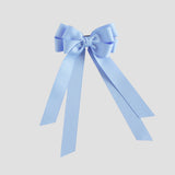 Blue bow with long tails on a white background