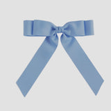 Light blue bow on a white background
