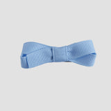 Light blue bow on a white background