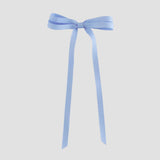 Light blue ribbon bow on a white background