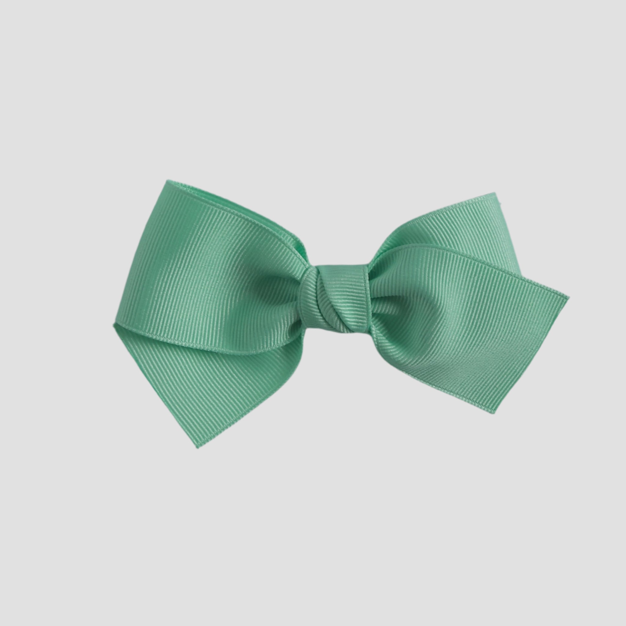 Mint green bow on a white background