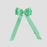 Mint green bow on a white background