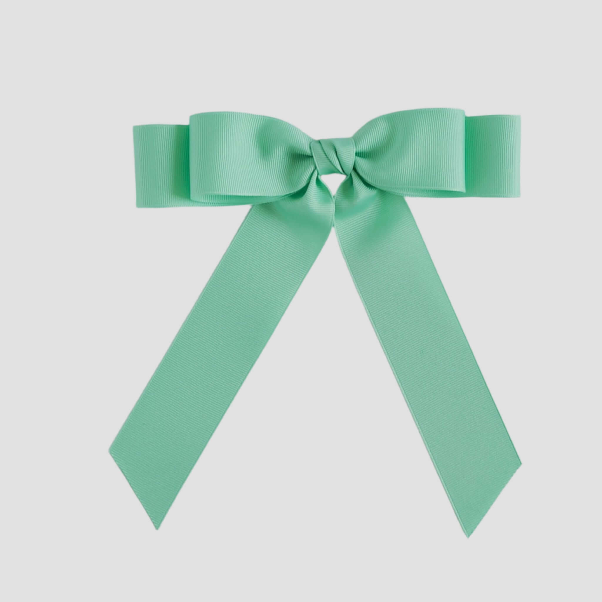 Mint green bow on a white background