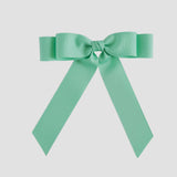 Mint green bow on a white background