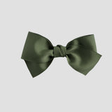 Moss green bow on a white background