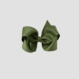 Moss green hair bow on a white background