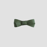 Moss green bow on a white background