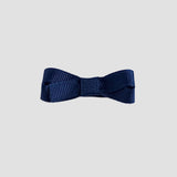 Navy blue bow on a white background