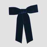 Navy blue Zoe petite velvet hair bow on a white background.