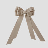 Oatmeal grosgrain Emerson bow with long tails on a white background