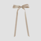 Oatmeal brown ribbon bow on a white background